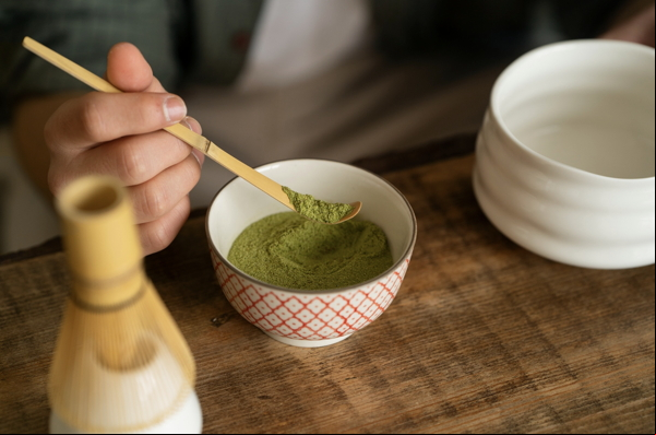 person-having-cup-matcha-tea
